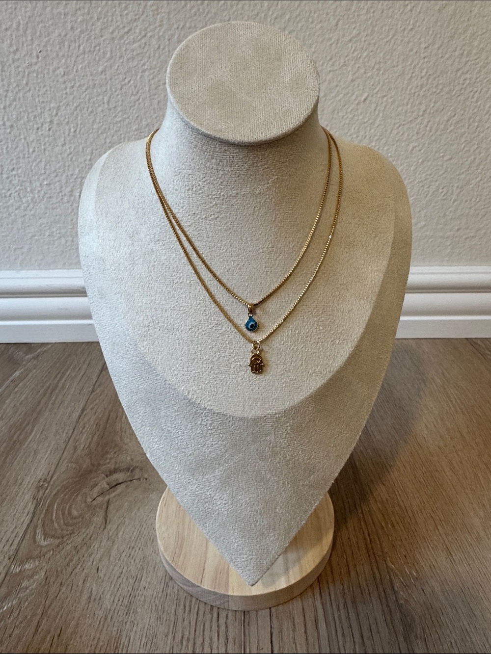 Gold Double-Layer Necklace with Blue Eye and Hamsa Charms. together as a set